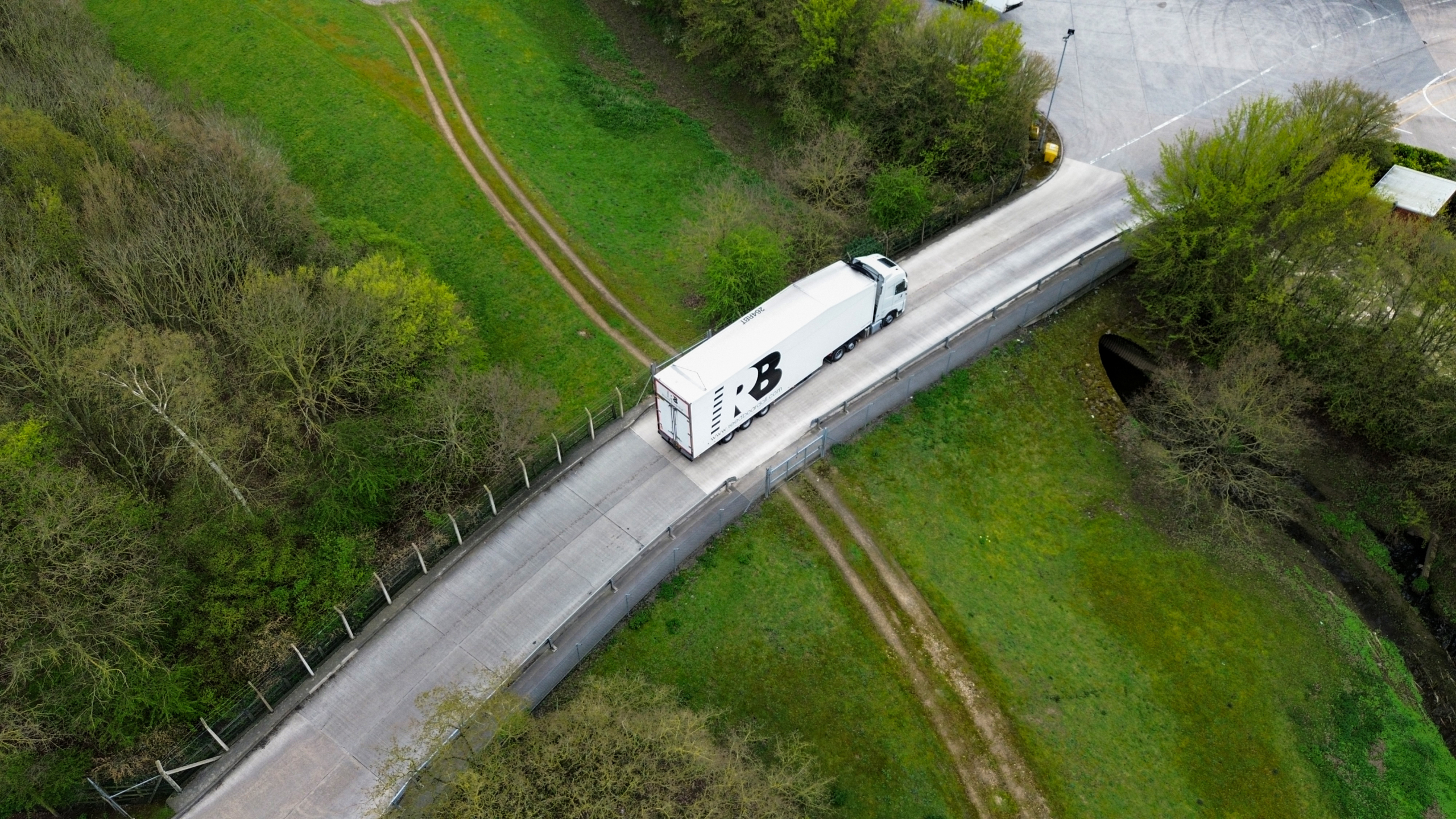 Reed Boardall truck driving over a bridge at Reed Boardall HQ