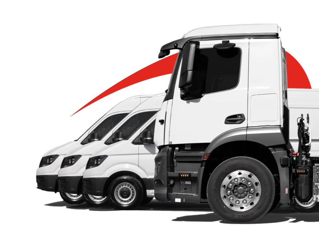profile view of a white HGV with safety cameras fitted and three white vans